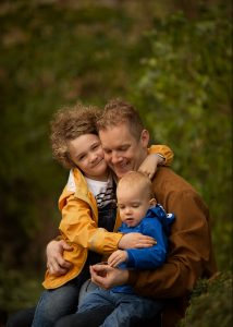 dad with daughter and one year old son at the park, autumn family photography
