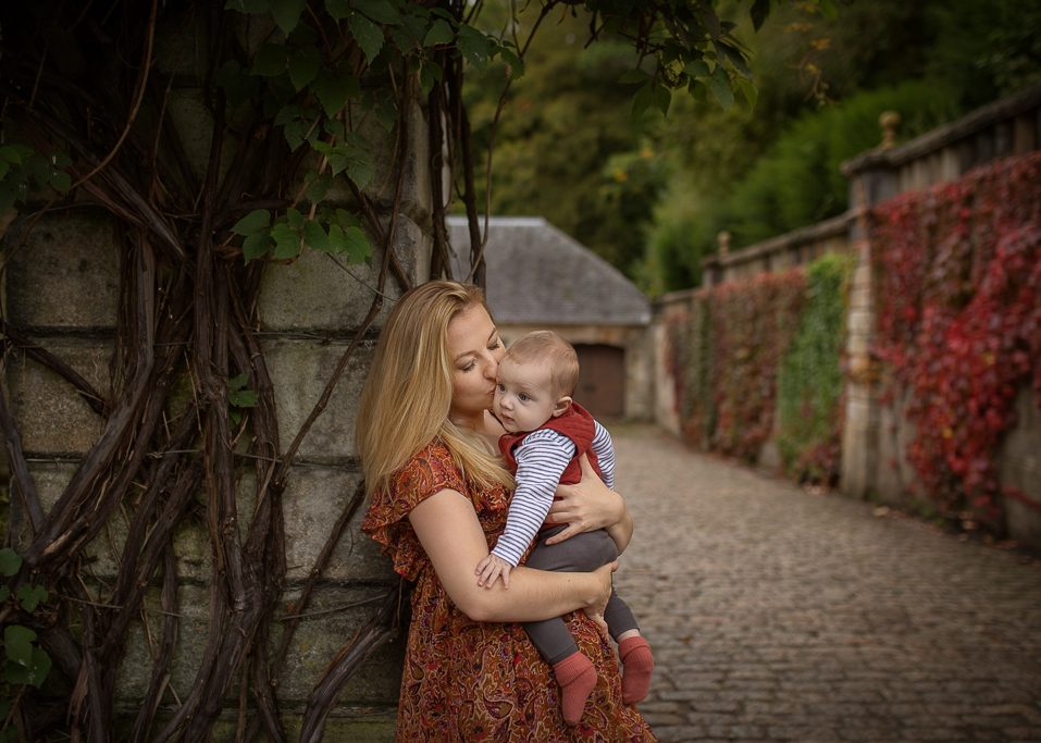 mother in floral maxi dress with toddler baby son at the autumn photoshoot at Pollok Country Park, Family outdoor photoshoot