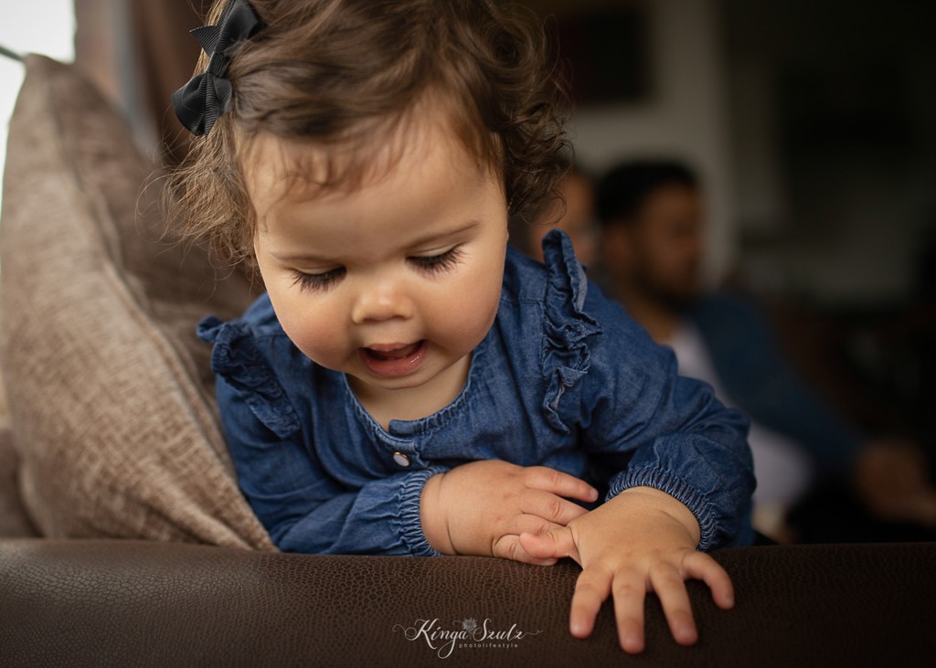 one year old baby girl portrait, long eyelashes, family photoshoot at the home