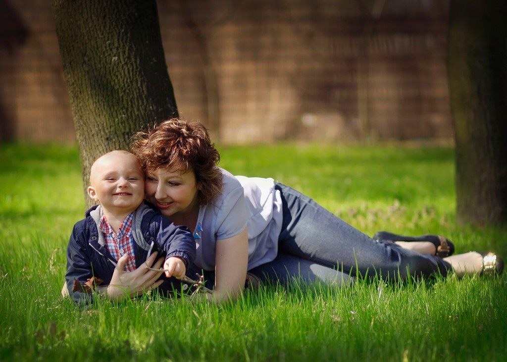 mother and toddler son spring outdoor portrait at the park