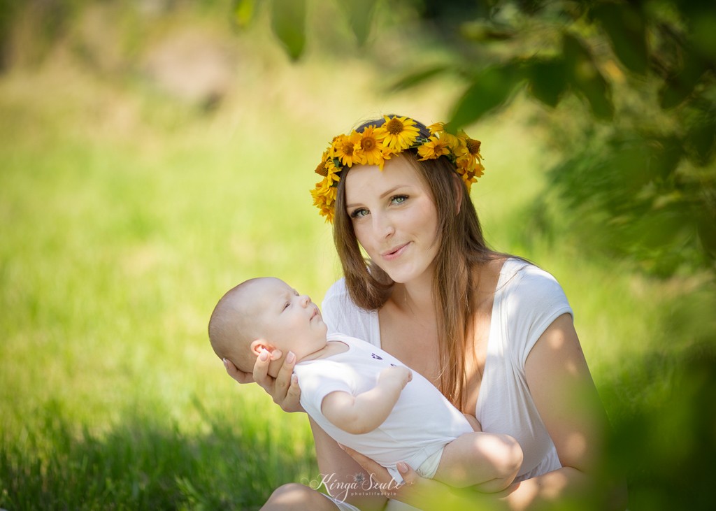 breastfeeding portrait Mother and 2 months old son in the garden