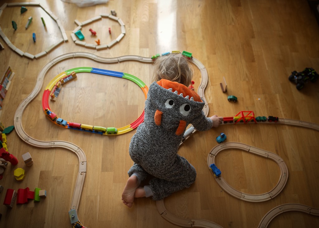 in home activities for children, playing wooden trains, in home lifestyle photoshoot