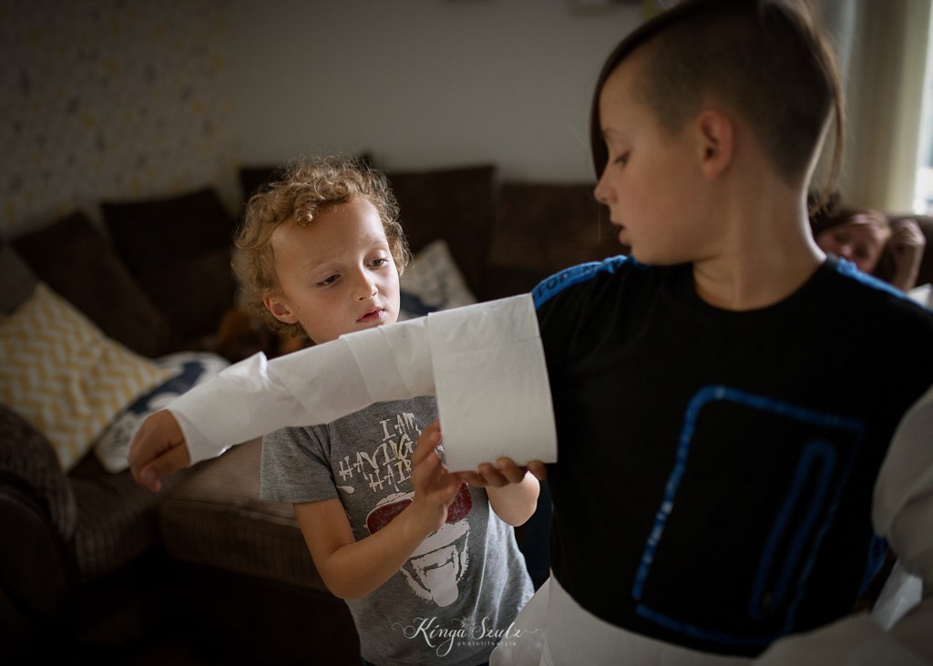 toilet paper mummies game, family in home documentary photoshoot