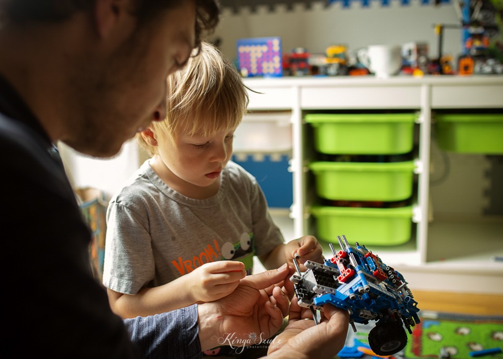 dad and boy playing lego technic, in home family photoshoot