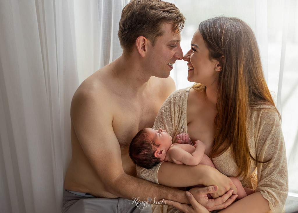 newborn baby girl with parents in boho lace dress, in home newborn photography