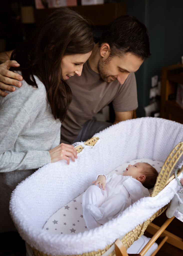 parents and newborn girl newborn photoshoot at home