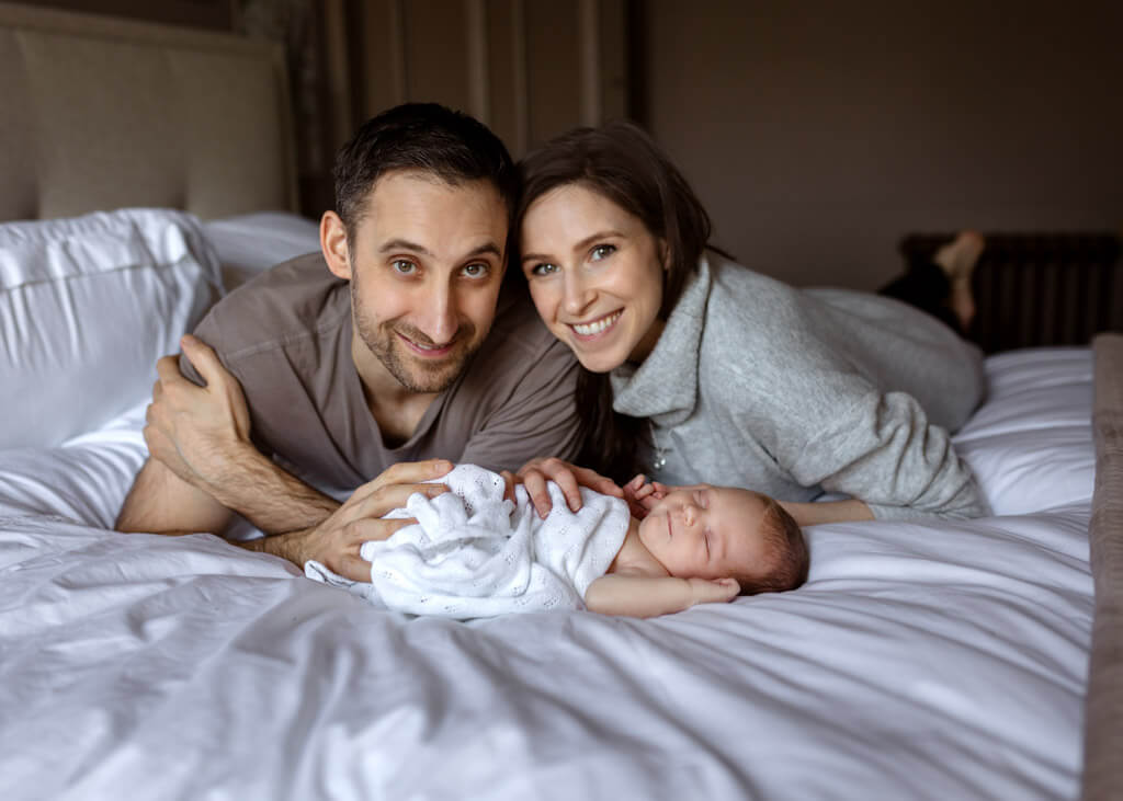 parents and newborn girl newborn photoshoot at home