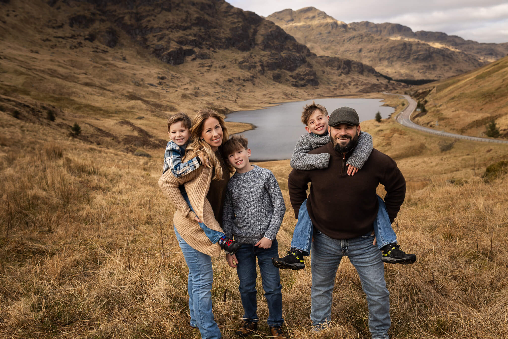 family of five duriing vacation family photography at Rest and be Thankful Scotland