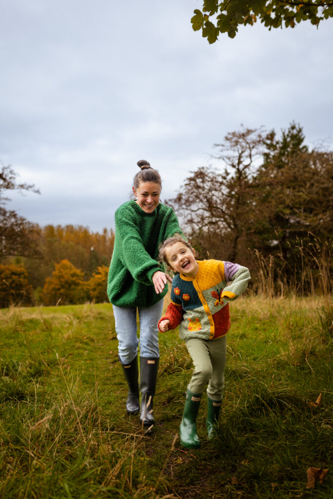 Family photoshoot in Glasgow featuring a mother and daughter spending time together outdoors. Natural family photography documenting real moments and meaningful connections.