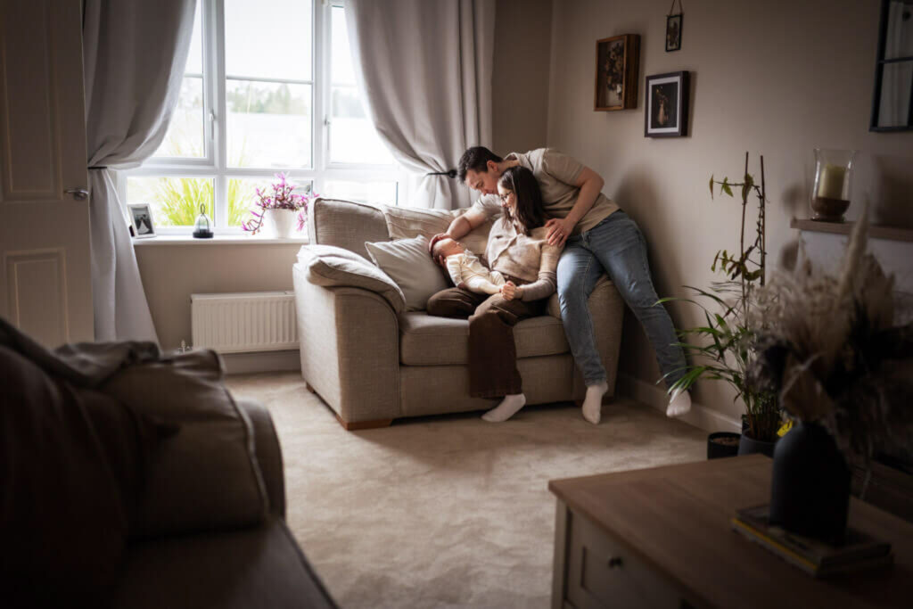 family with newborn baby and older sibling during an at-home newborn session in Glasgow